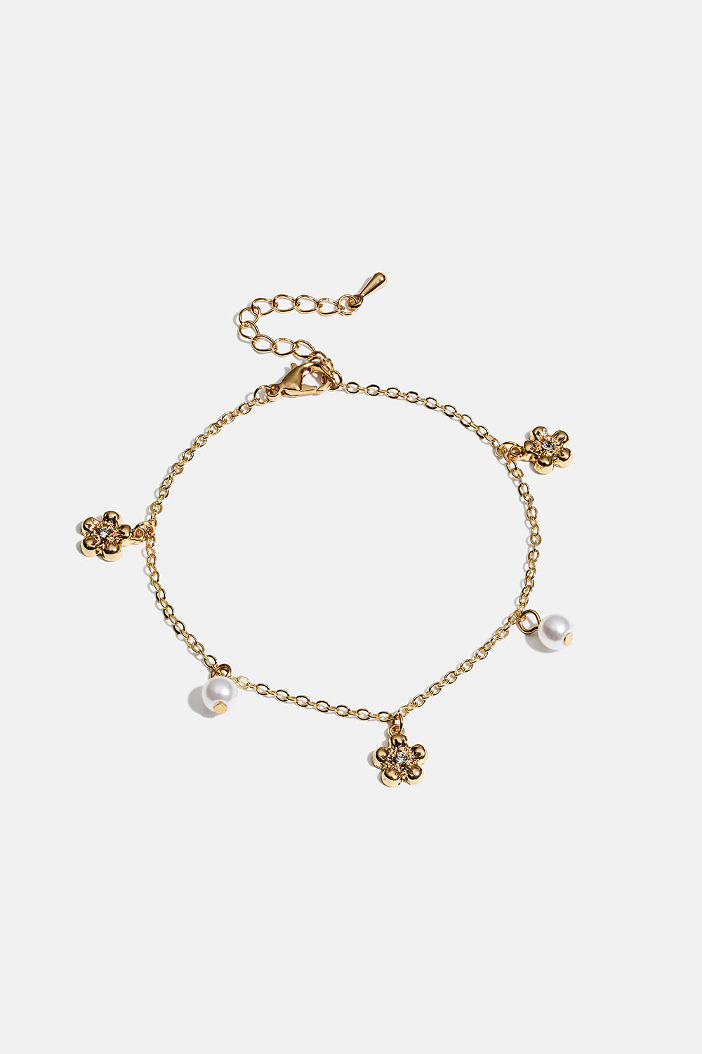 Gullfarget armbånd med blomster og hvite perler i gruppen Smykker / Armbånd / Tynne hos Glitter (251001952002)