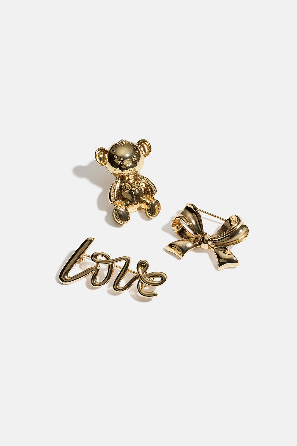 Gullfargede brosjer med sløyfe, bjørn og Love, 3-pakning i gruppen Smykker / Brosjer hos Glitter (252000192002)