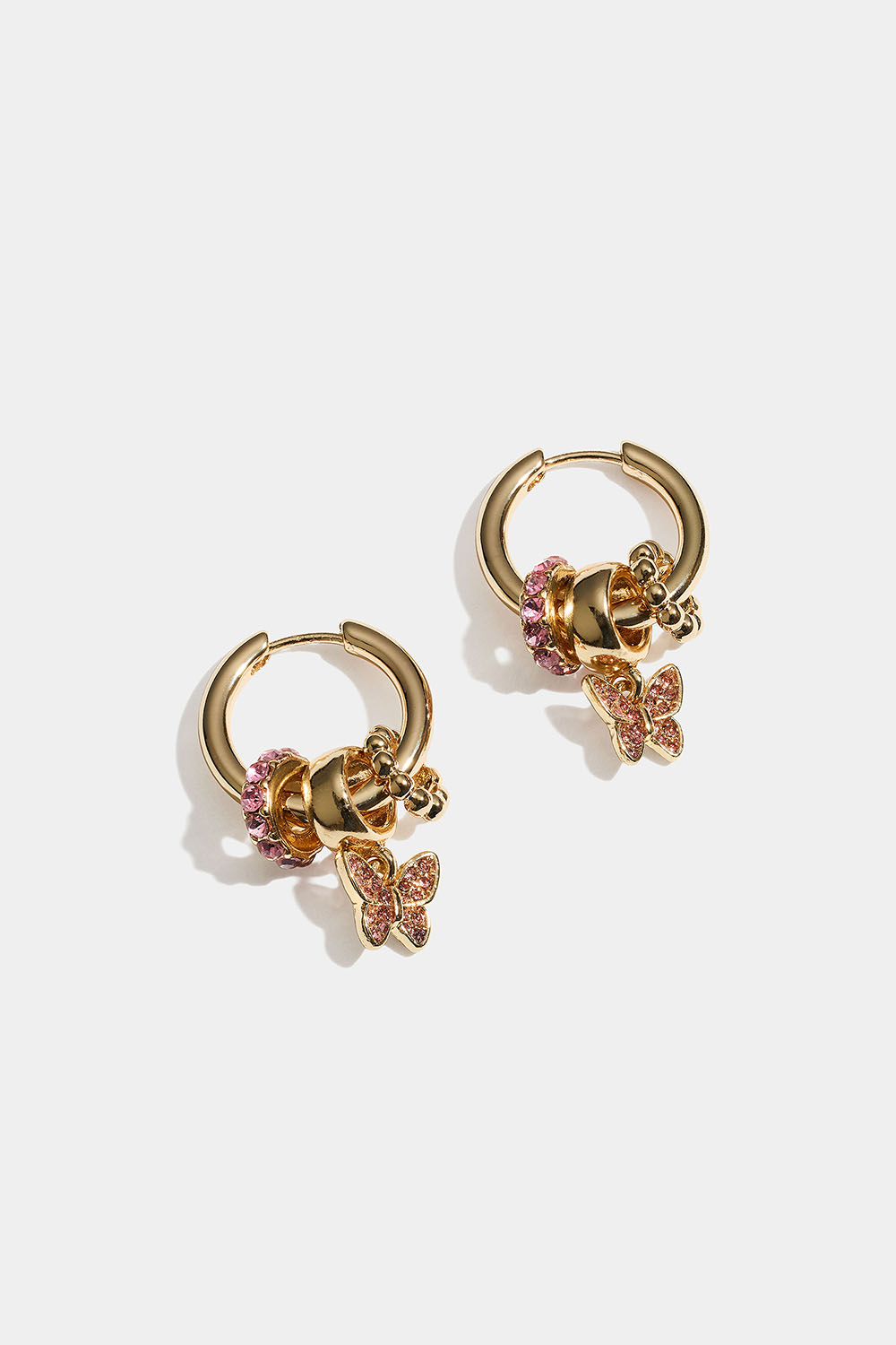 Gullfargede ringer med sommerfugl og rosa glassteiner i gruppen Smykker / Øredobber / Øreringer / Øreringer med anheng hos Glitter (253011102002)