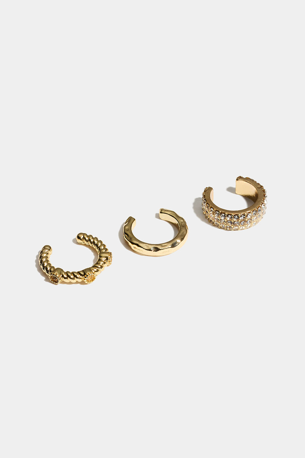 Gullfargede ear cuffs med struktur og glassteiner, 3-pakning i gruppen Smykker / Øredobber / Earcuffs hos Glitter (253011792002)