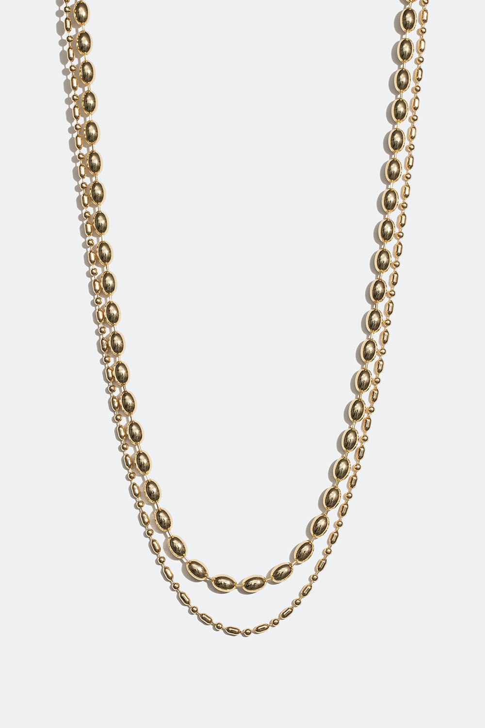 Gullfarget, dobbelt halskjede med ovale perler i metall i gruppen Smykker / Halskjeder / Halskjeder med anheng hos Glitter (254001312002)