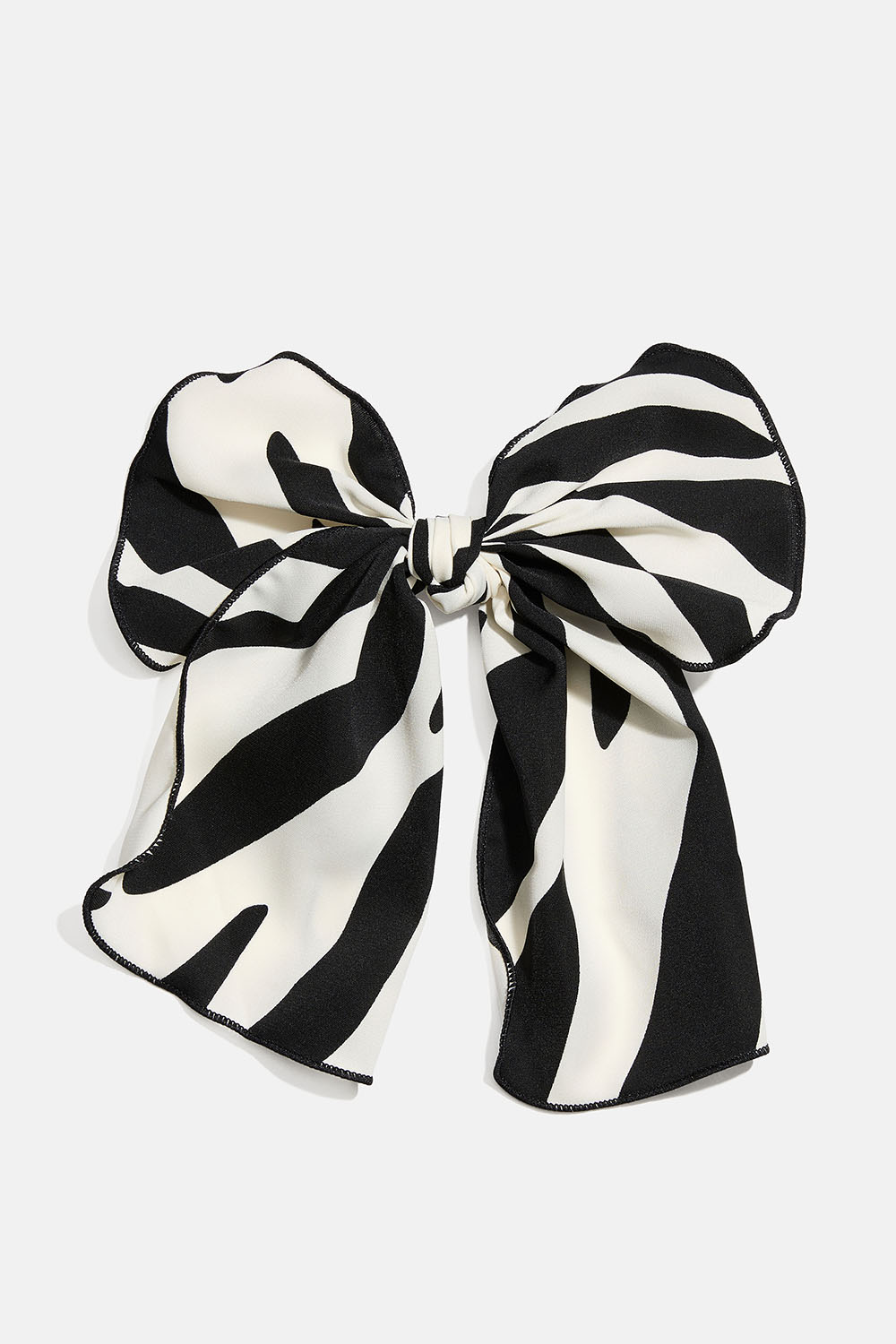 Hårspenne med sløyfe i sebramønstret stoff i gruppen Håraccessories / Spenner & klemmer / Hårdekorasjon hos Glitter (335002080800)
