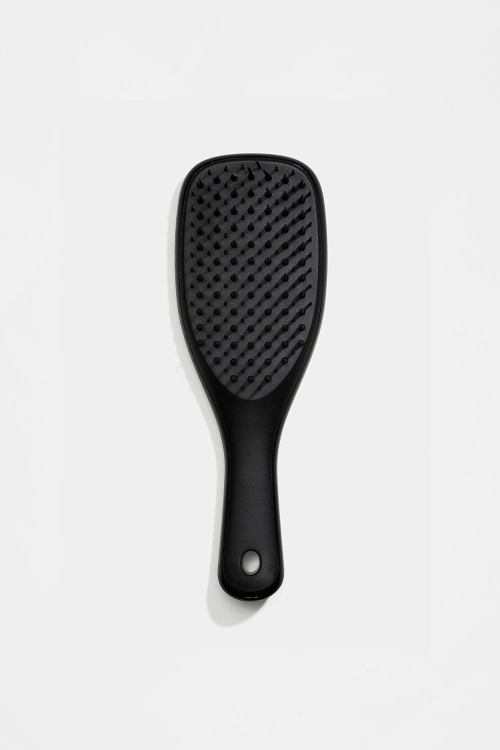 Liten, svart hårbørste mot floker i gruppen Håraccessories / Styling & verktøy / Hårbørster hos Glitter (337000019000)