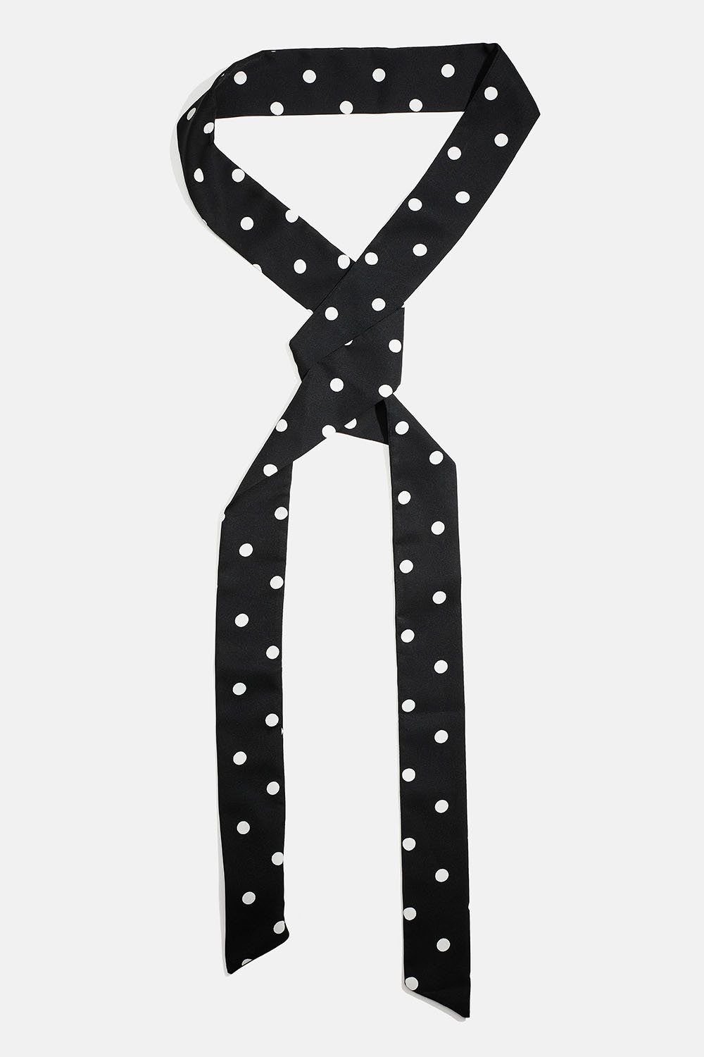 Smalt, svart skjerf med hvite prikker