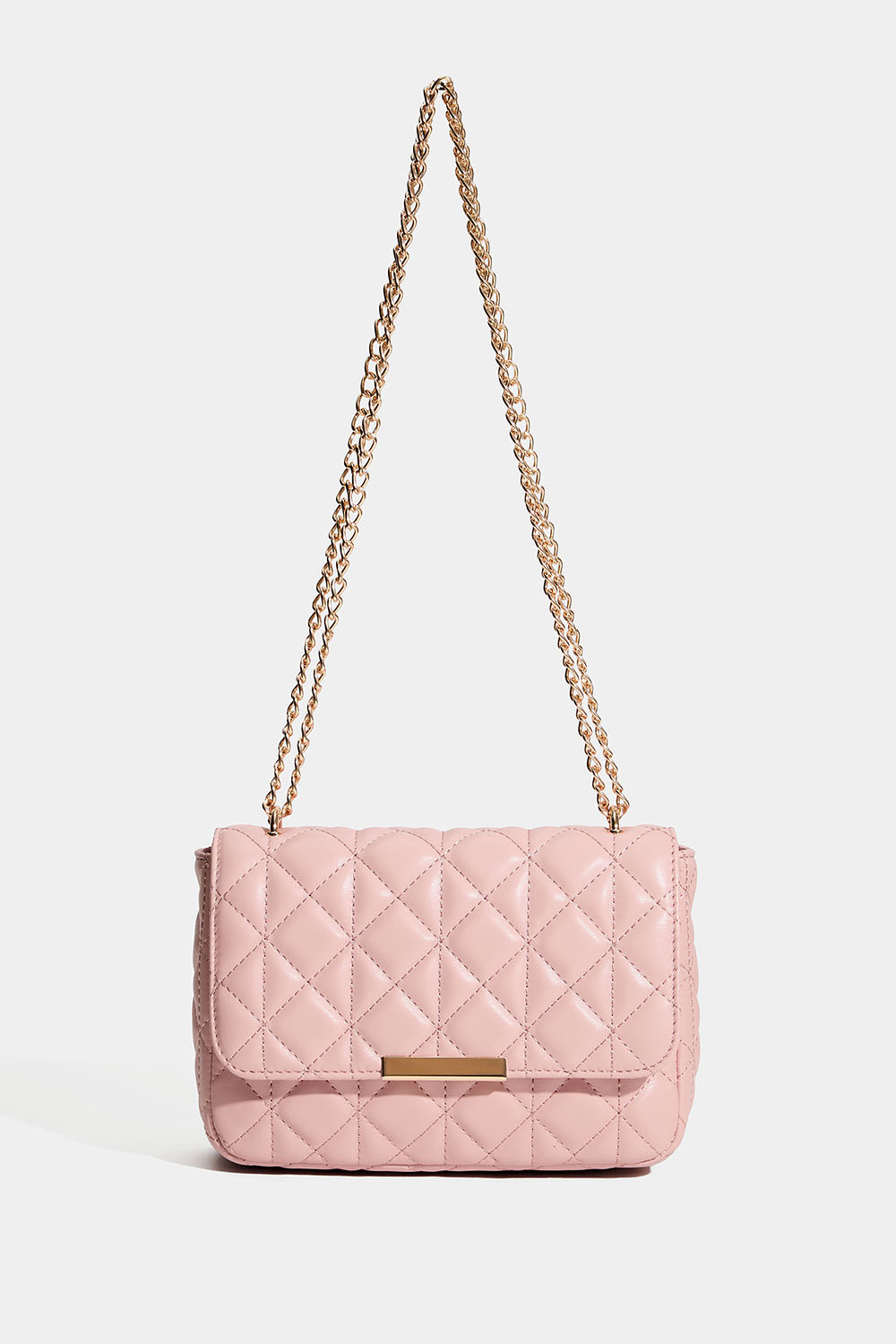 Rosa veske med quiltet design og gullfarget skulderrem