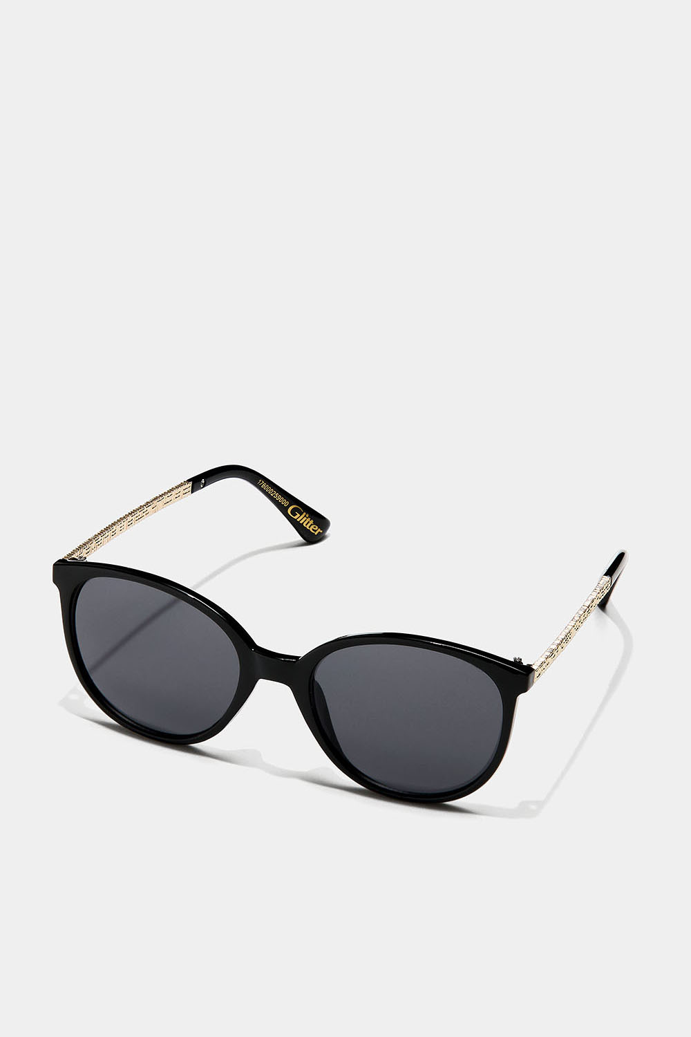 Sorte cateye-solbriller med gullfargede detaljer