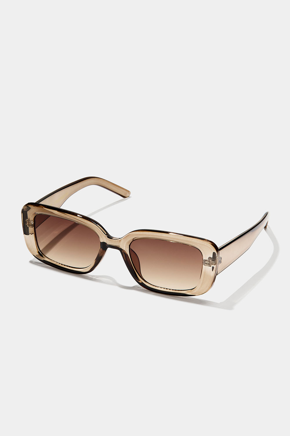 Kantete solbriller med gjennomsiktig, lysebrun innfatning