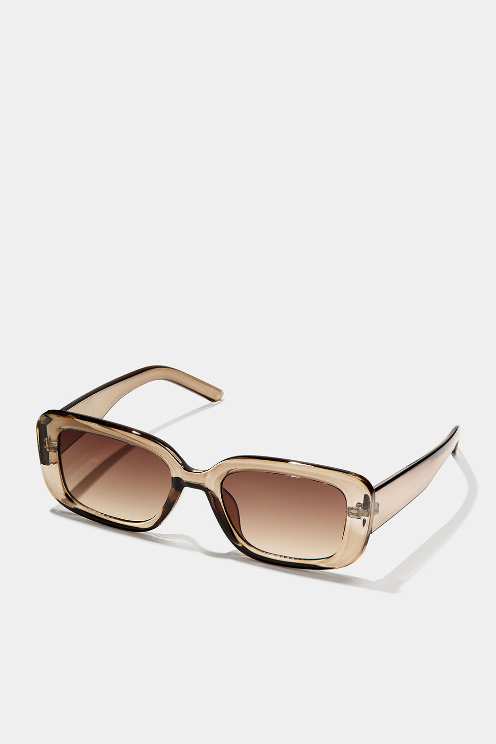 Kantete solbriller med gjennomsiktig, lysebrun innfatning