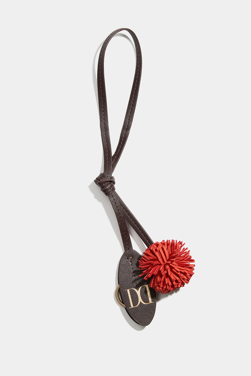 Veskedekor med pompong og nøkkelring