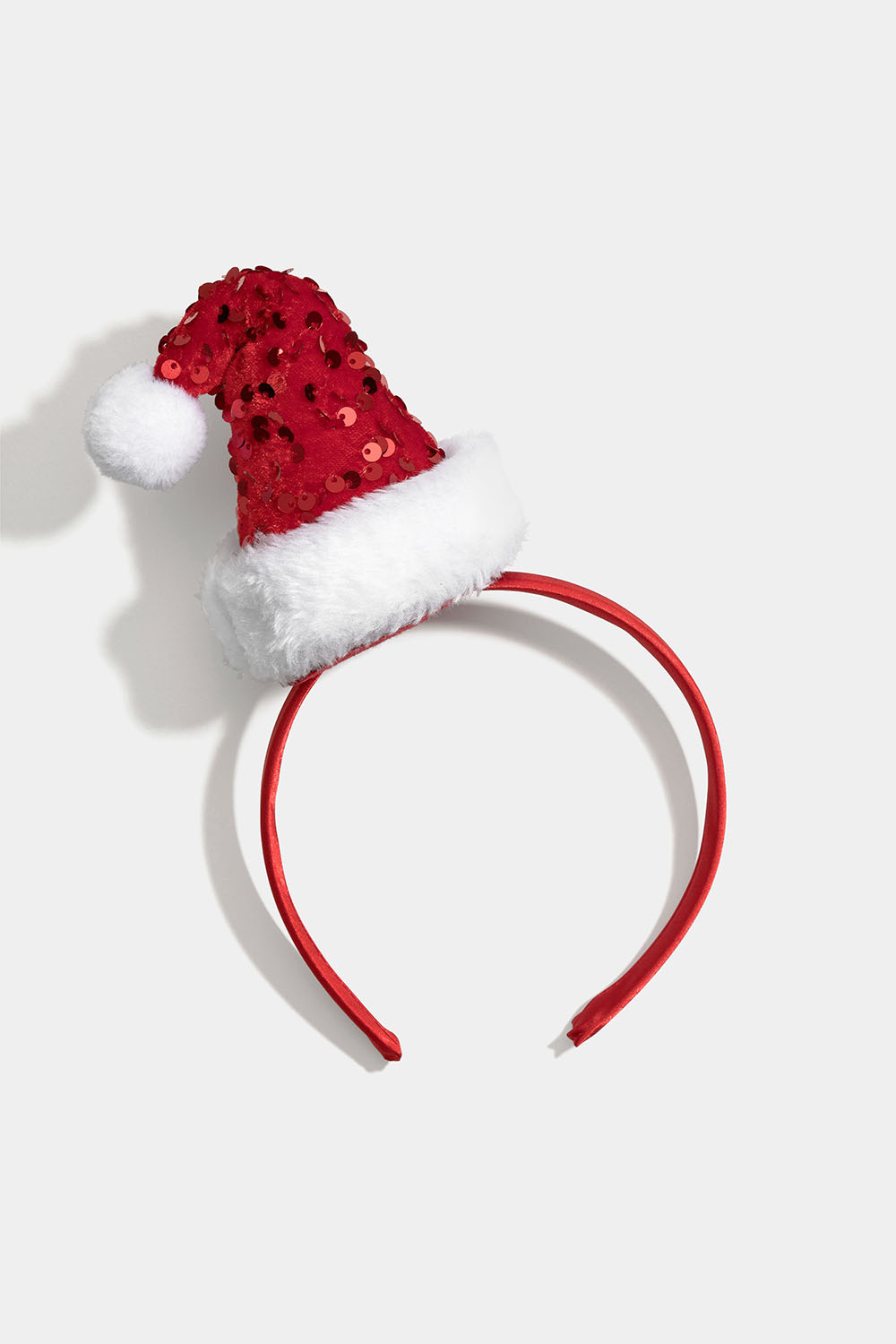 Hårbøyle med nisselue i slike og paljetter