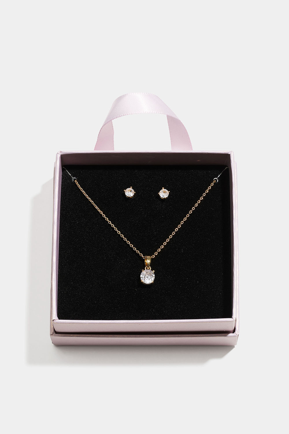 Gullfarget smykkesett med glasssteiner i gaveeske