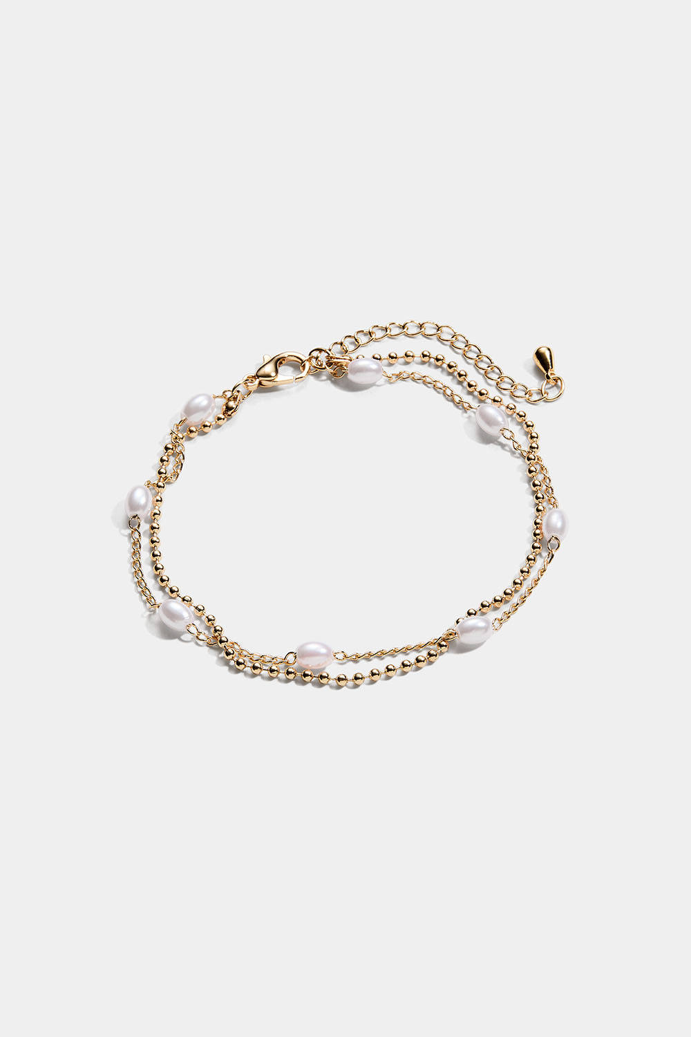 Gullfarget dobbeltarmbånd med ovale perler
