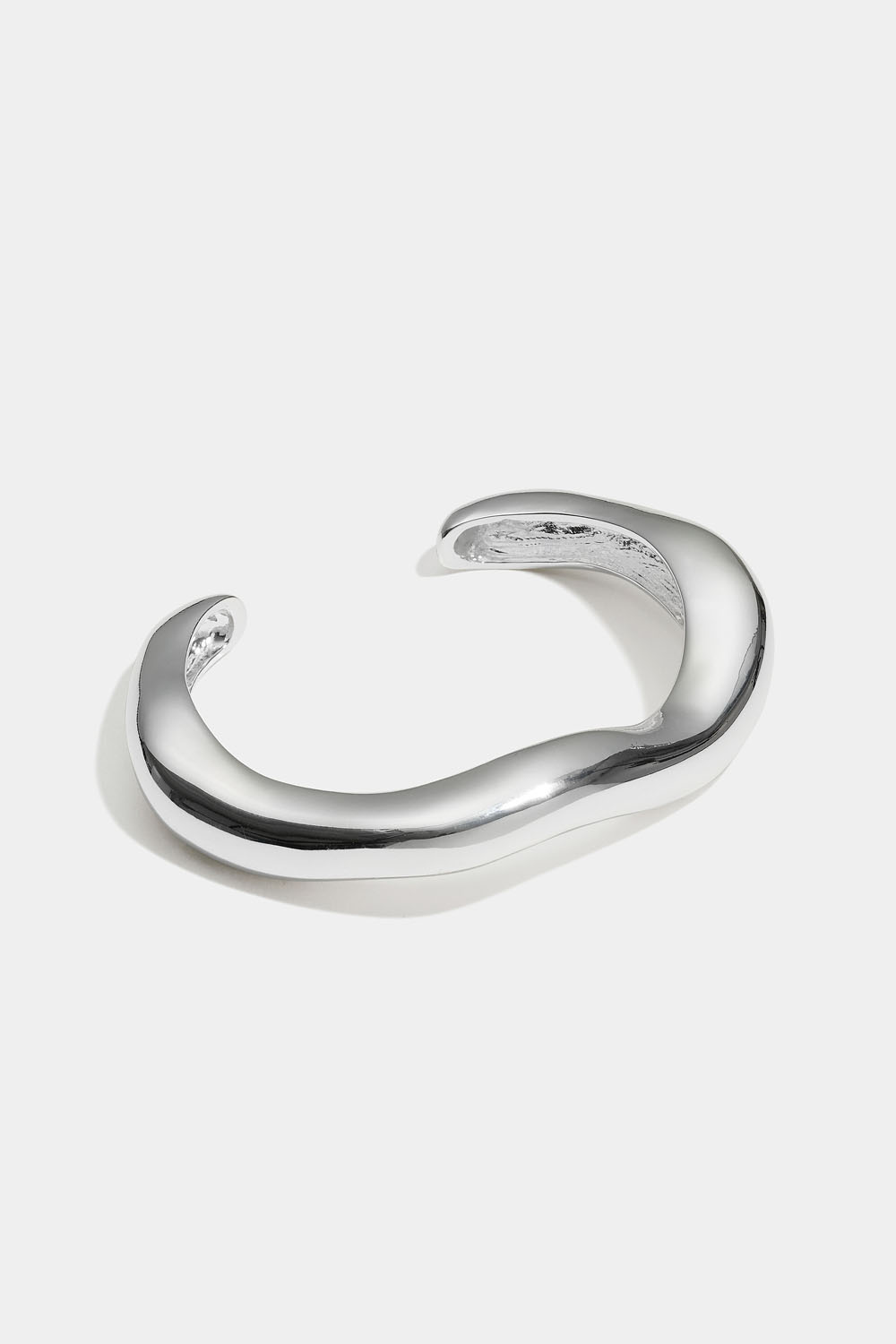 Mansjettarmbånd med organisk form