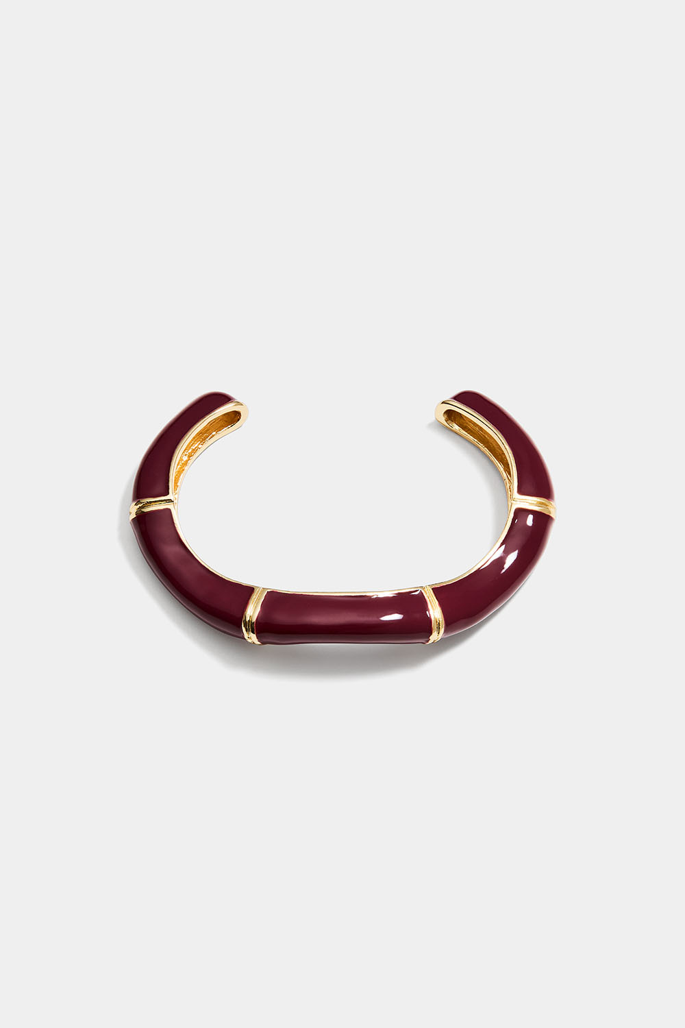 Burgunderrødt mansjettarmbånd med organisk form