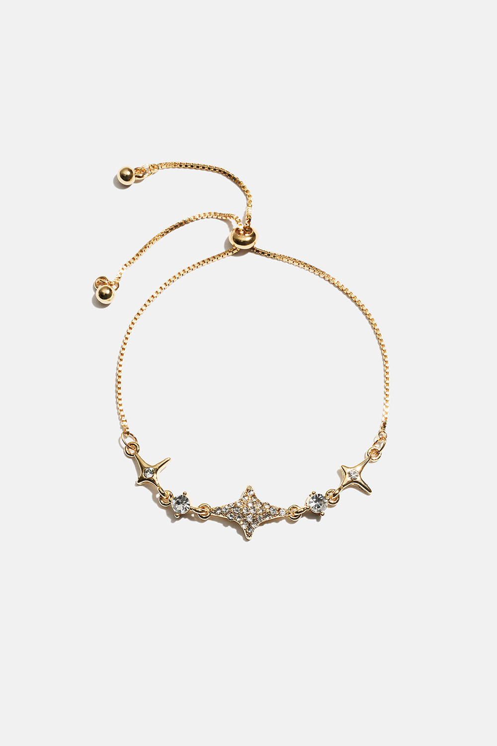 Gullfarget armbånd med stjerner og strass