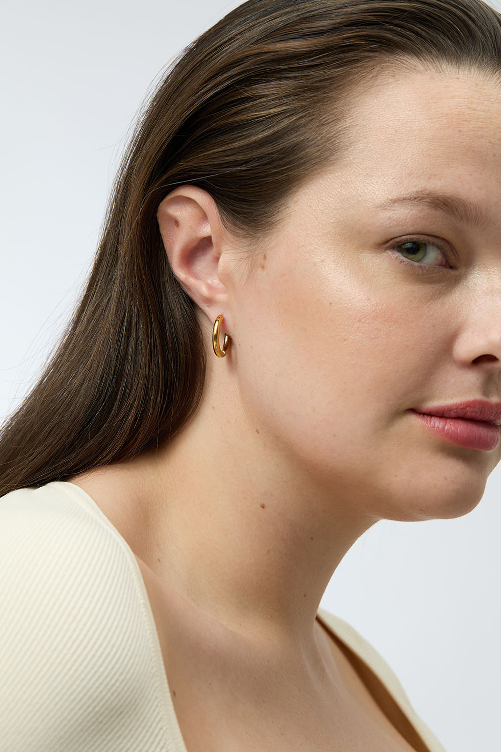 Øreringer i stål med 18 k gull 