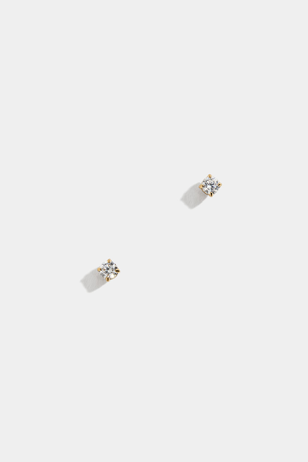 Mini-stiftøredobber i stål med 18 karat gull og zirkonia