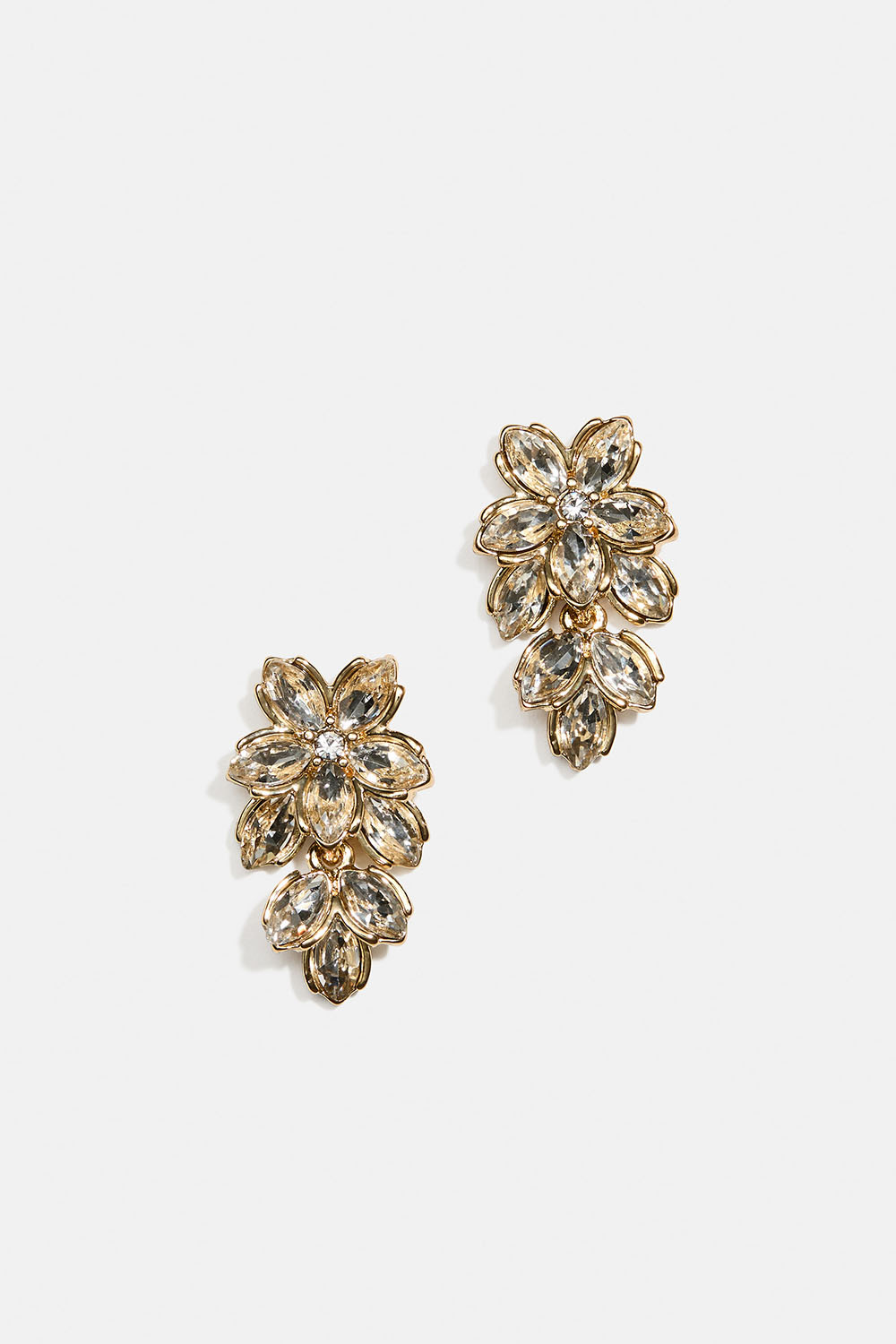 Gullfargede øredobber med blomster, glassteiner og blader