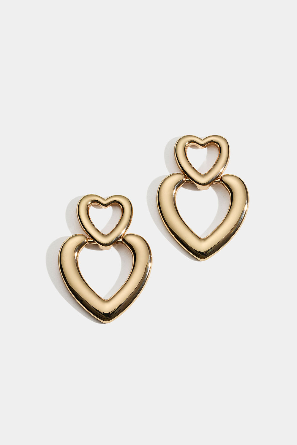Gullfargede øredobber med to hjerter