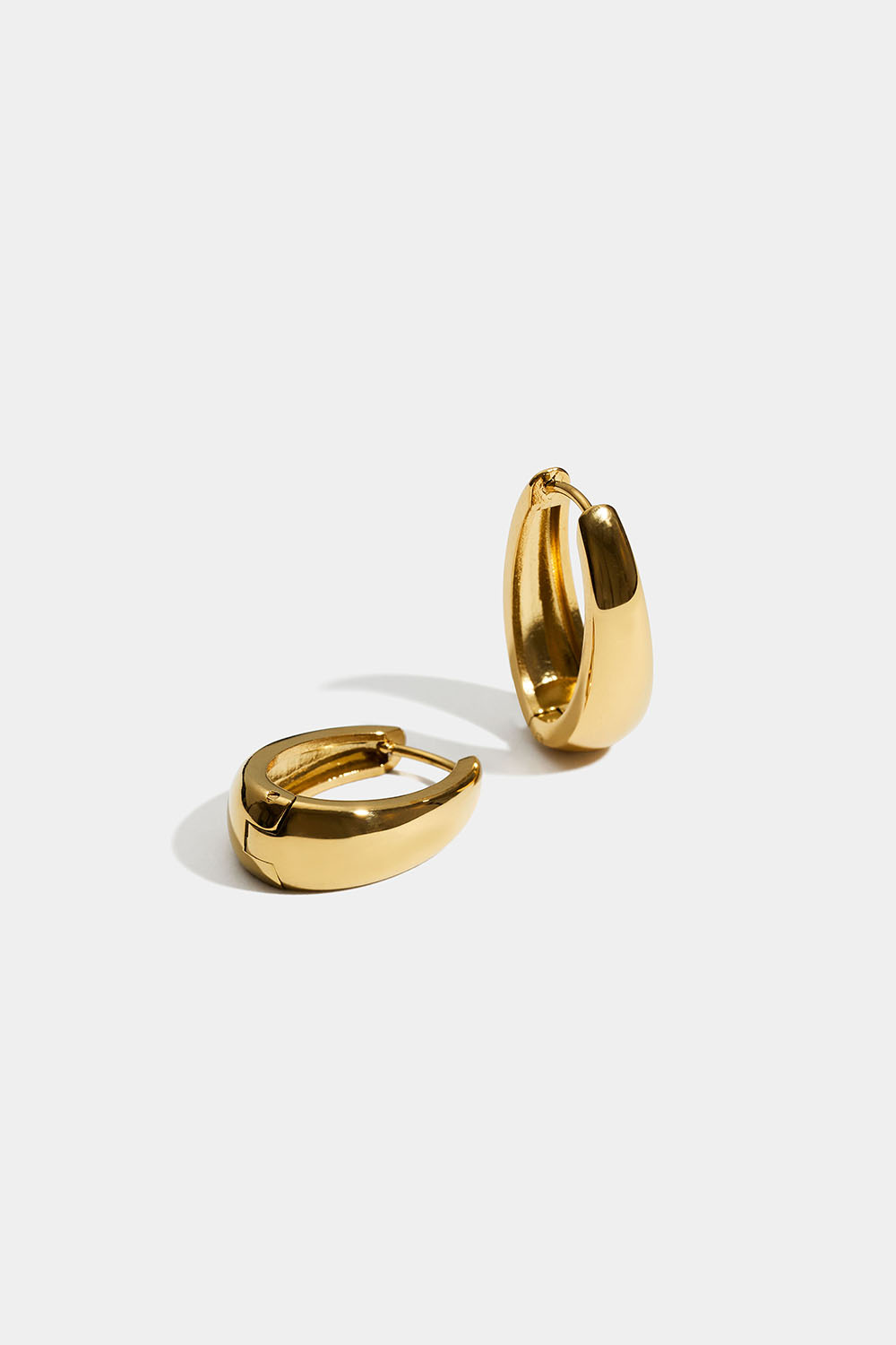 Ovale hoops i stål med 18 k gull