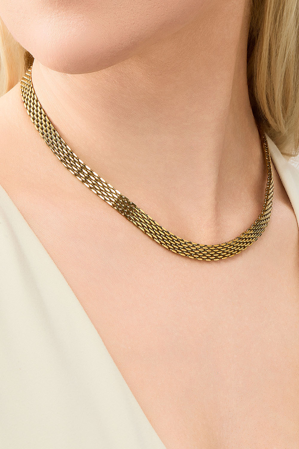 Flatt kjedehalskjede i stål med 18 karat gull.