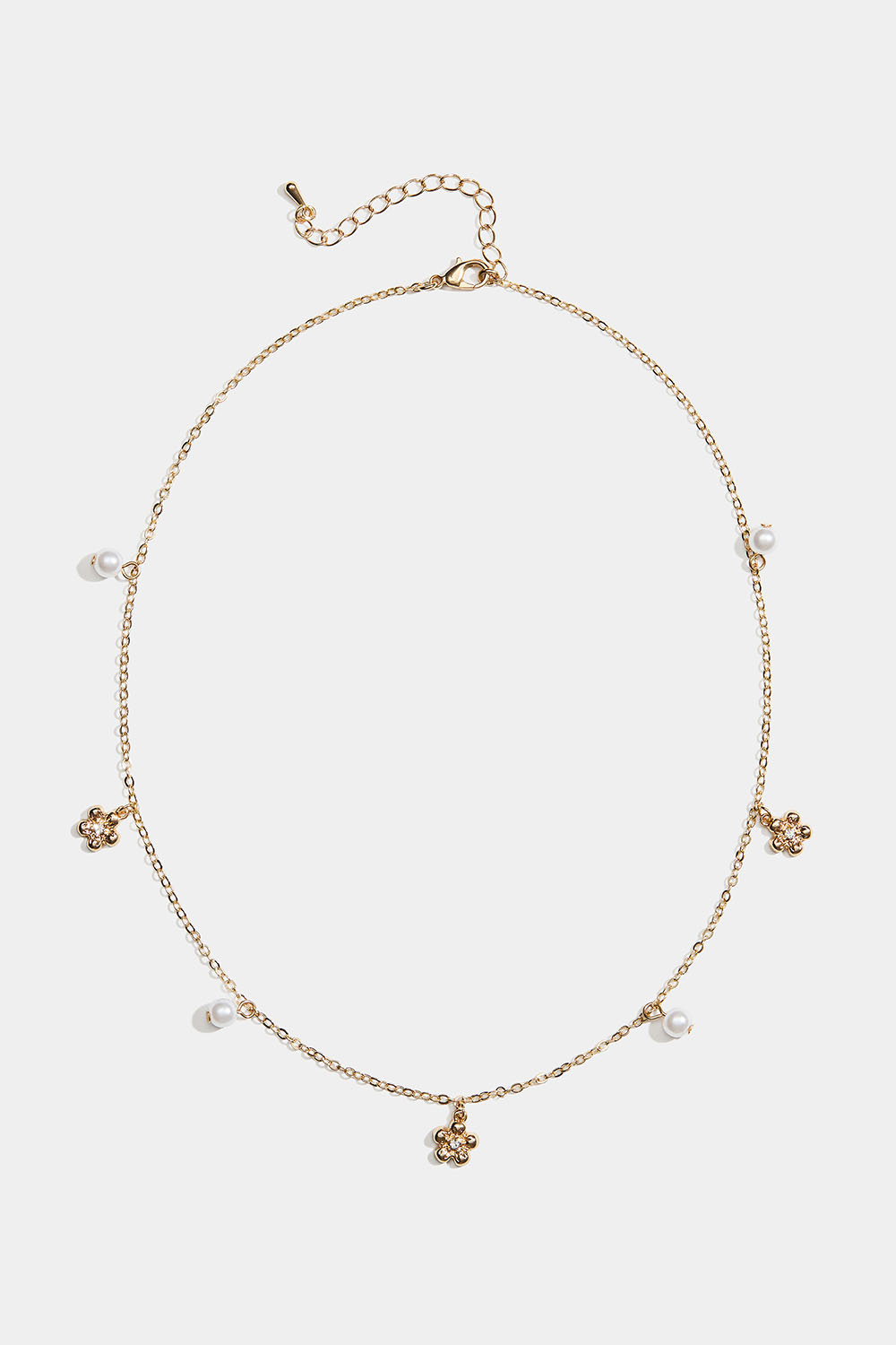 Gullfarget halskjede med blomster og hvite perler