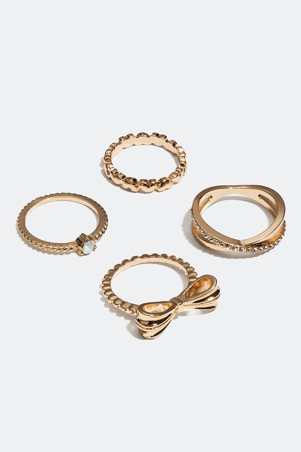 Gullfargede ringer med sløyfe, hjerte og glassteiner, 4-pakning