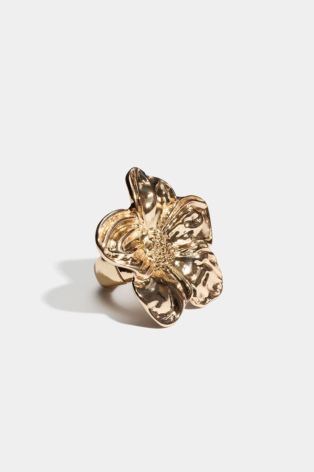 Justerbar gullfarget ring med blomst