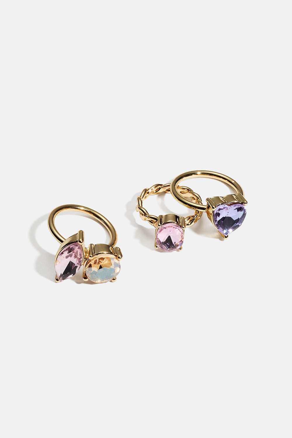 Gullfargede ringer med store glassteiner i ulike utforminger, 3-pakning