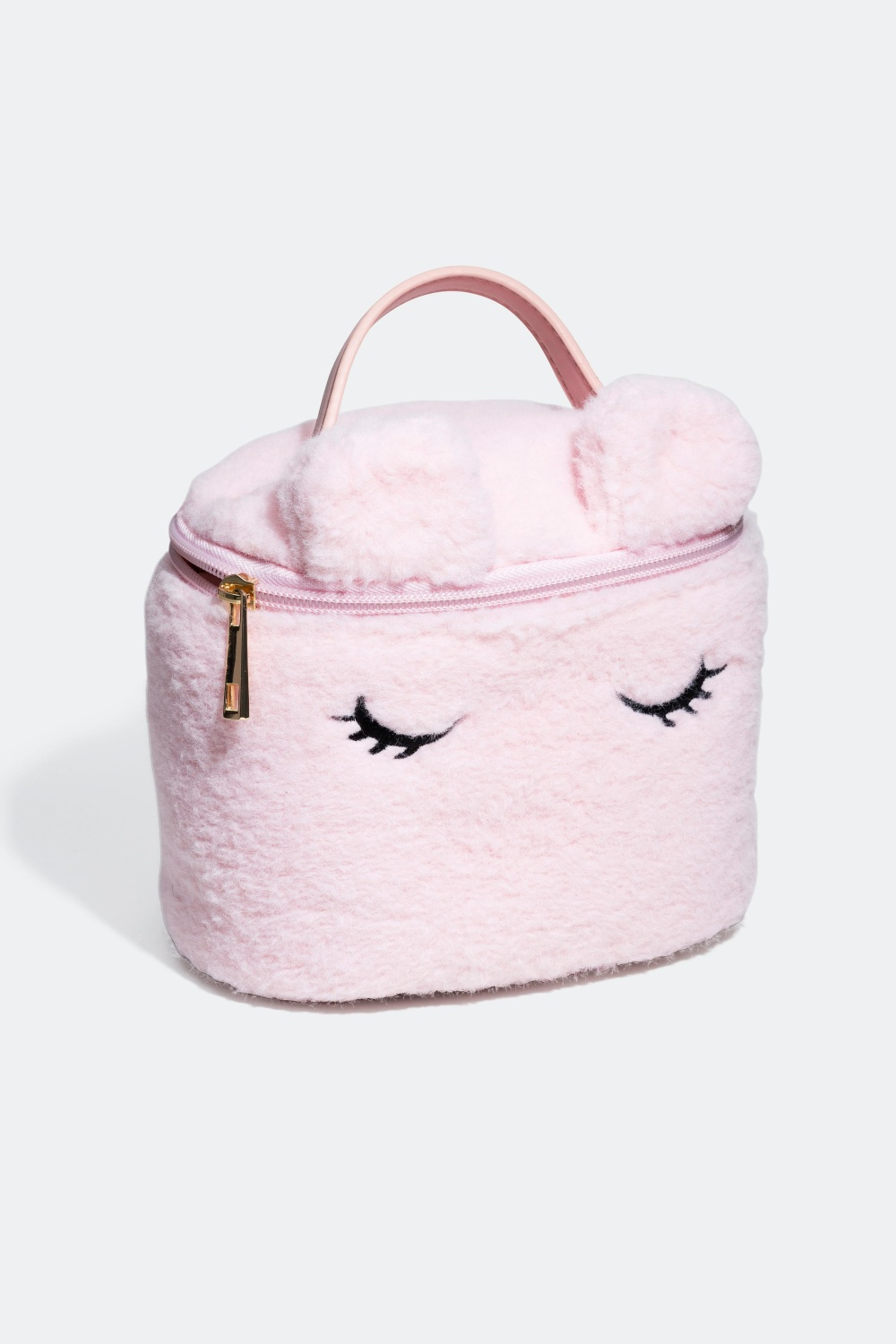 Veske med fluffy stoff og håndtak