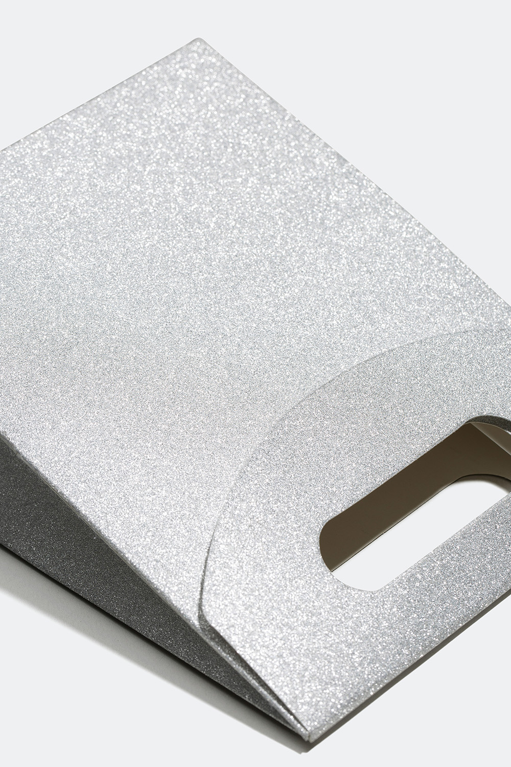 Gavepose som glitrer i forskjellige farger