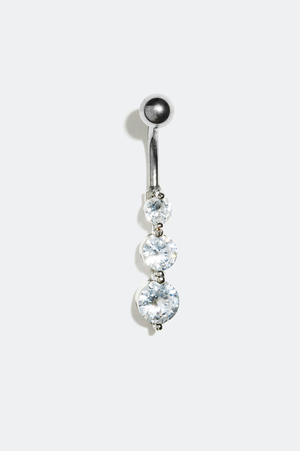 Navlepiercing med tre glassteiner