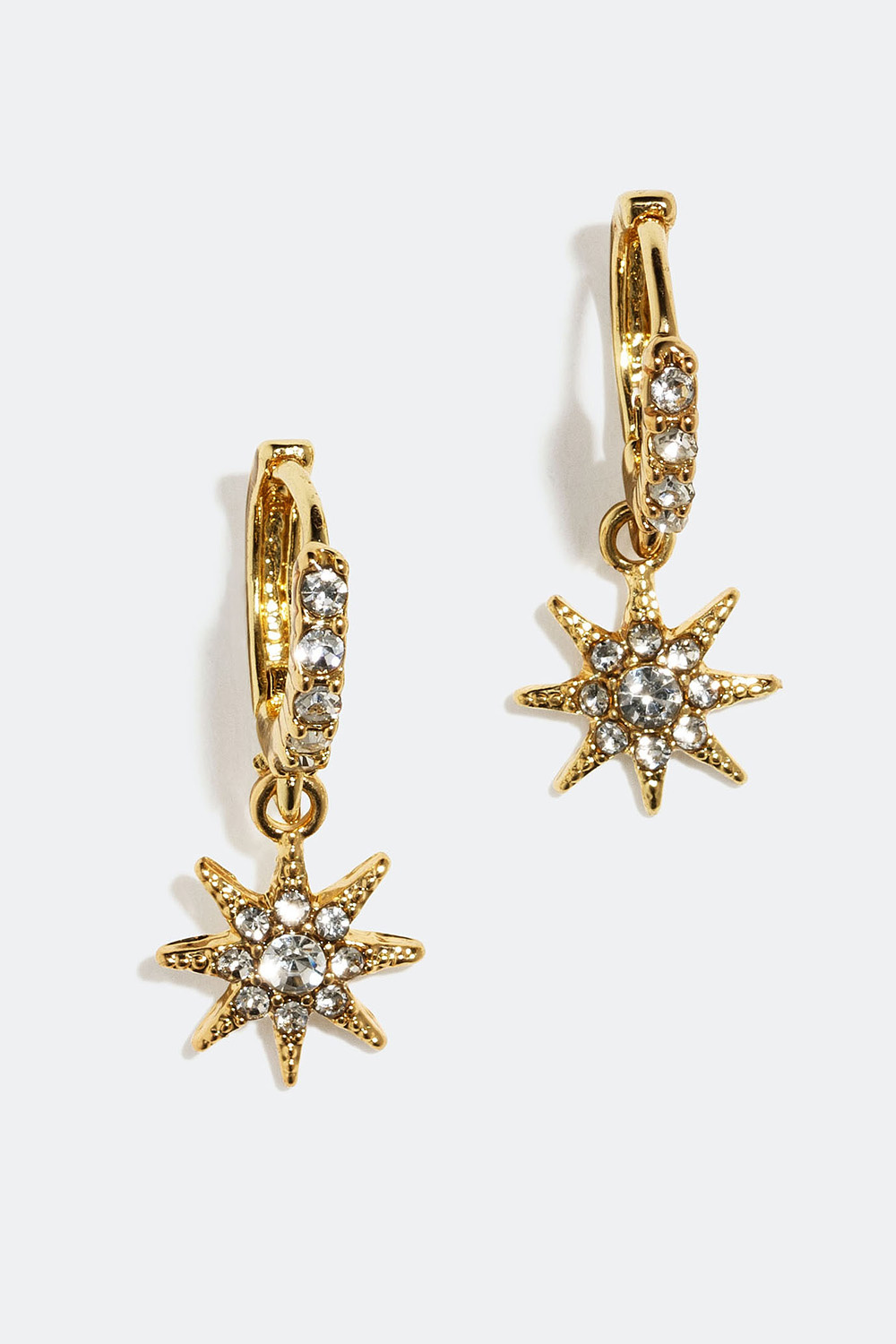 Øreringer med stjerneformede anheng og glassteiner