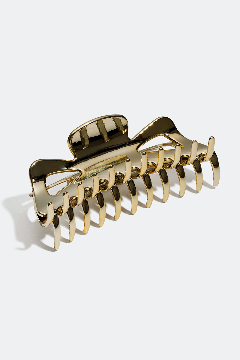 Stor hårspenne i gulll