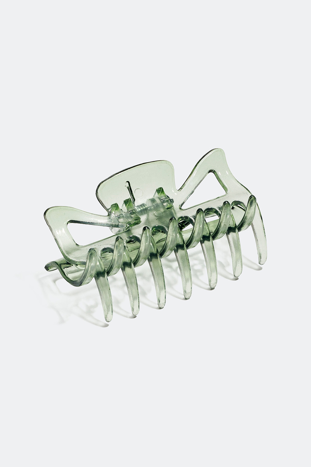 Liten grønn hårklemme