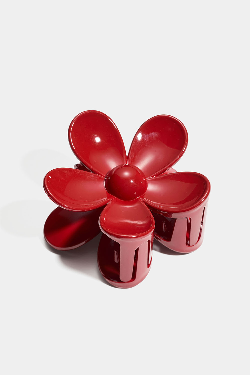 Rød blomsterformet hårklemme