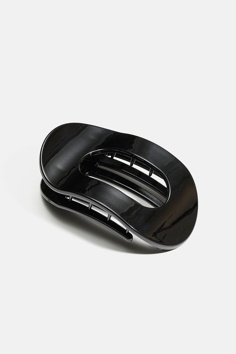 Svart oval flat hårspenne