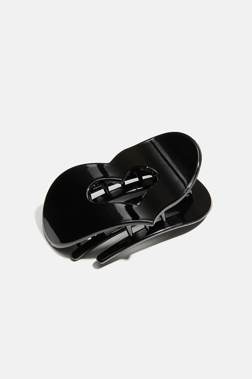 Svart hjerteformet flat hårklemme