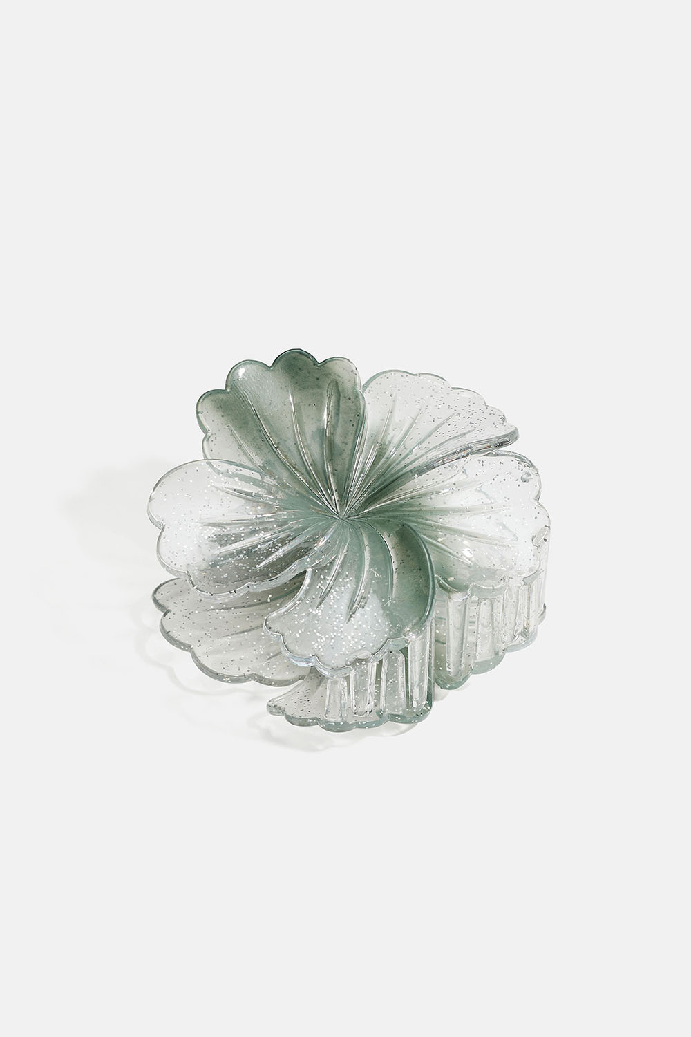 Grønn rund hårspenne med blomstermotiv