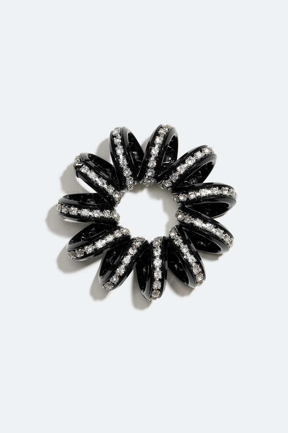 Svart spiralhårstrikk med glasstein