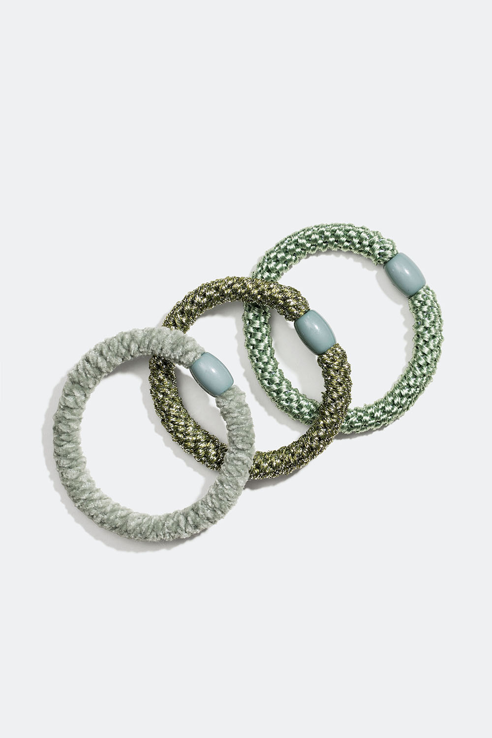 En blanding av flettede hårstrikker i grønt, 3 pakning