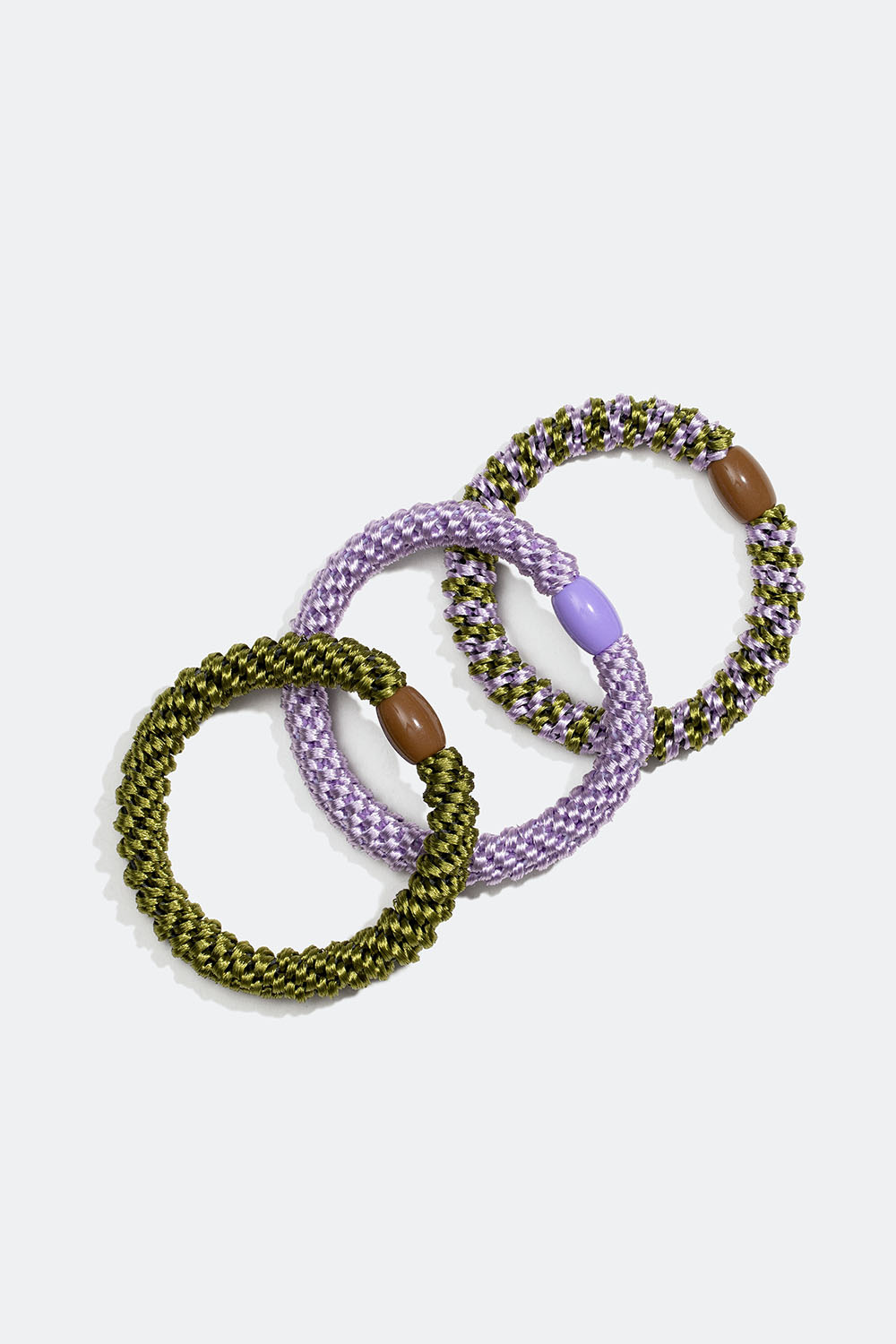 Flettede hårstrikker i en blanding av lilla og grønt, 3-pakning