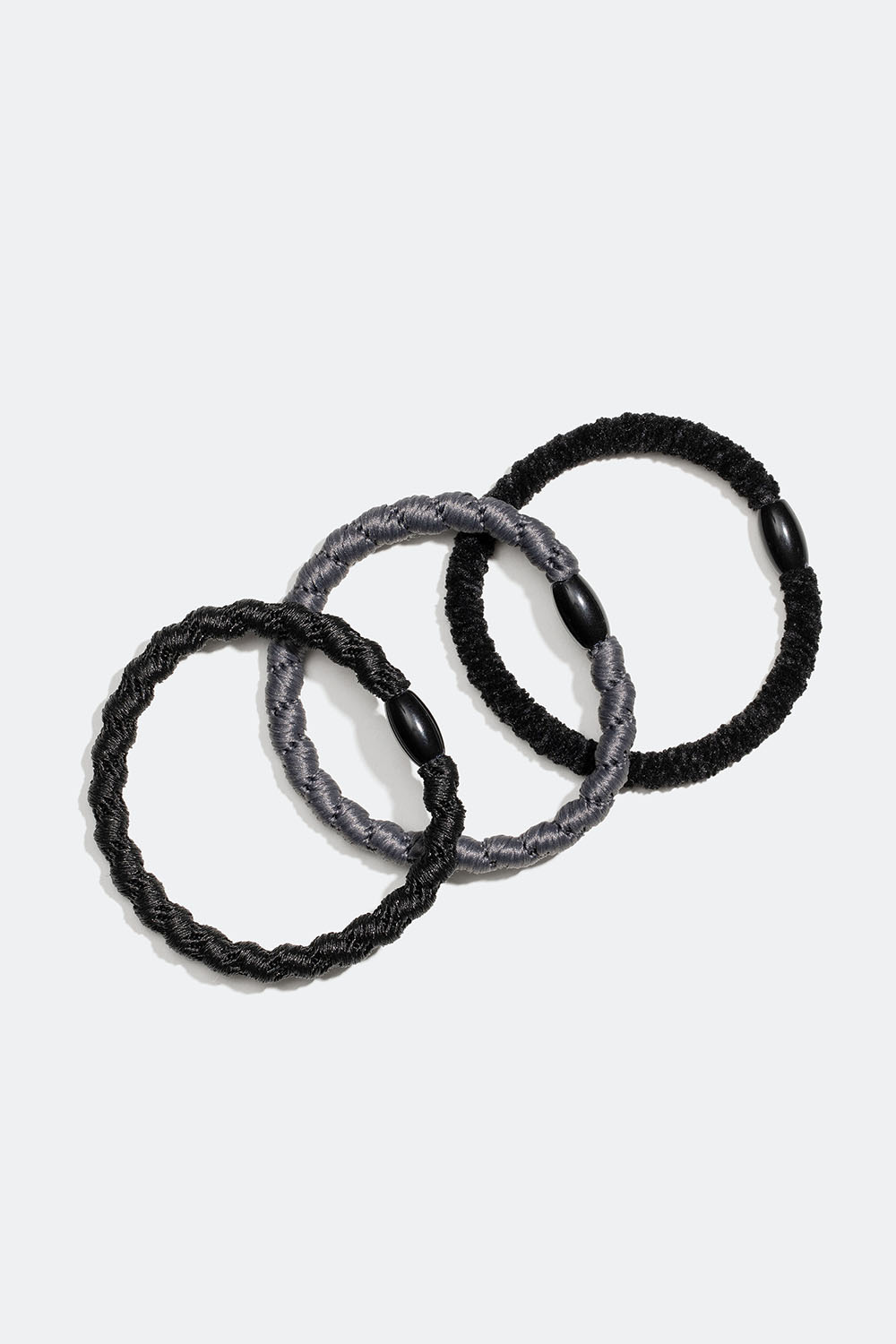 Smale, flettede hårstrikker i svart, 3-pakning