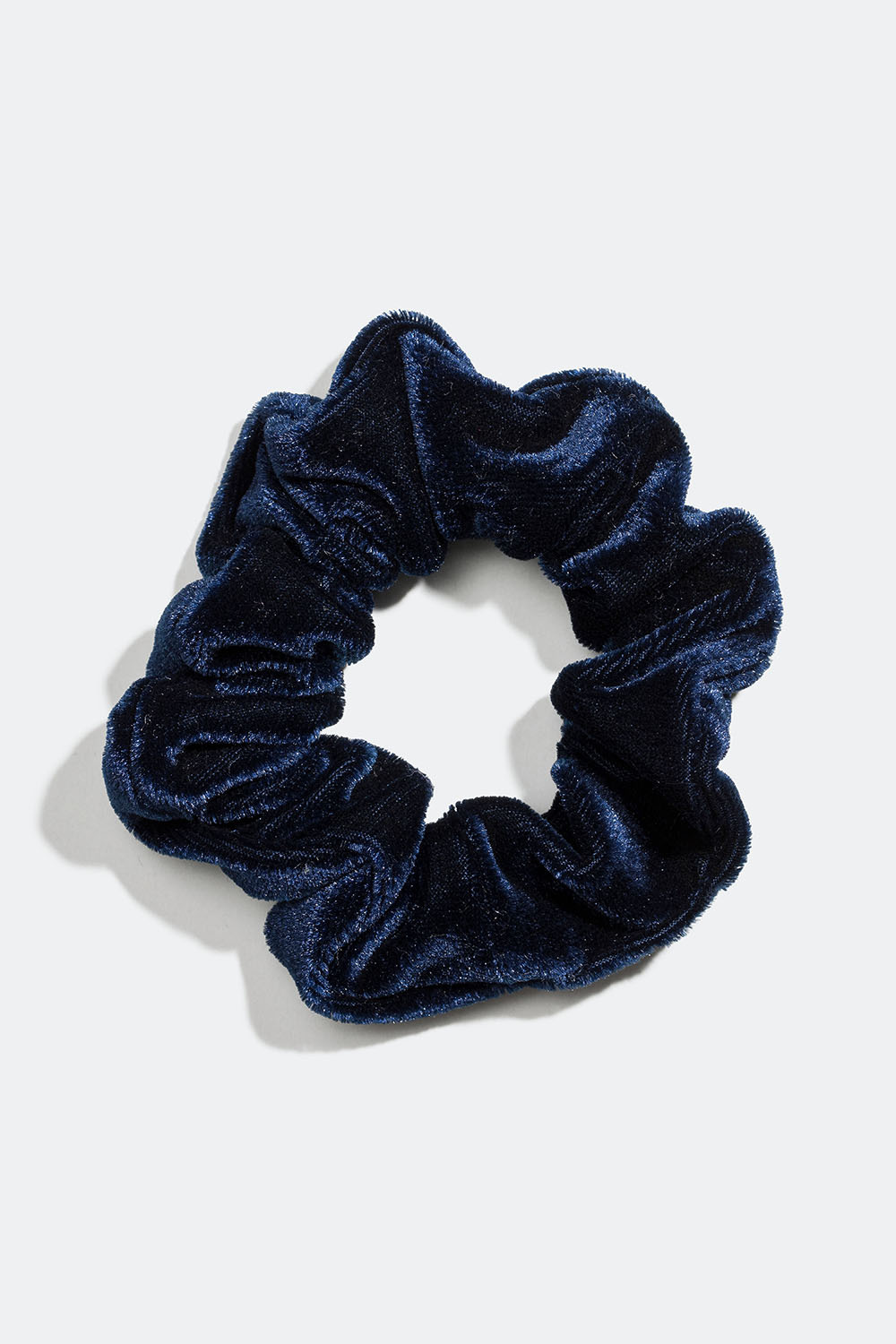 Mørkblå scrunchie i imitert fløyel
