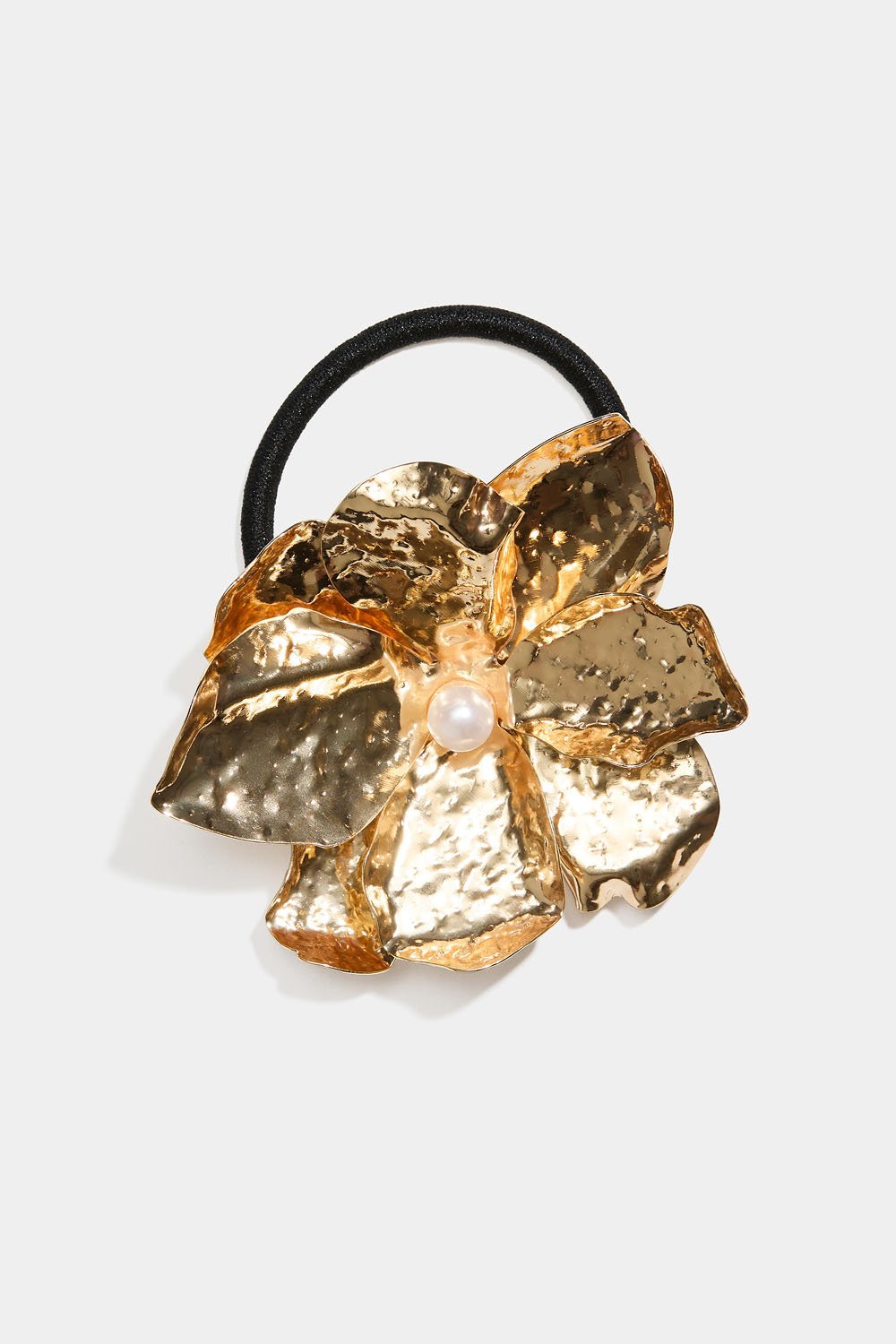 Hårstrikk med metallblomst