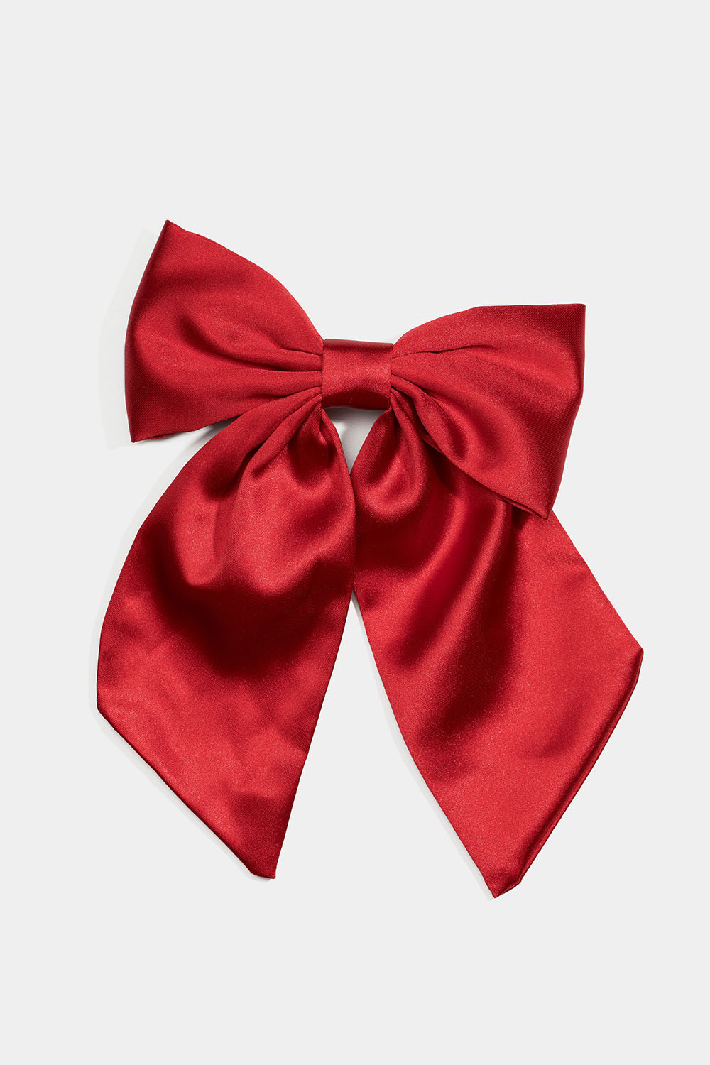 Hårspenne med rød sløyfe i imitert silke