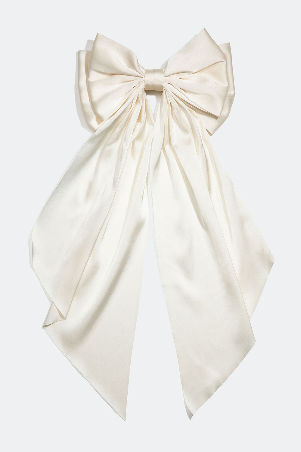 Hårspenne med stor, hvit sløyfe i silkeimitasjon