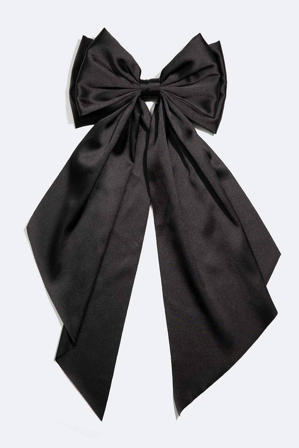 Hårspenne med stor, svart sløyfe i silkeimitasjon