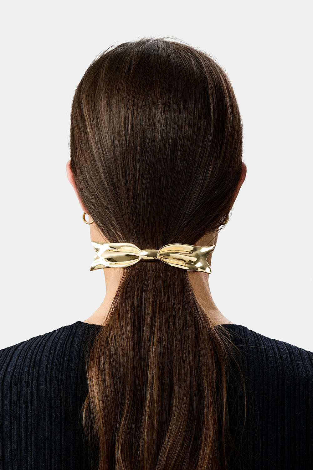 Gullfarget hårspenne med sløyfe
