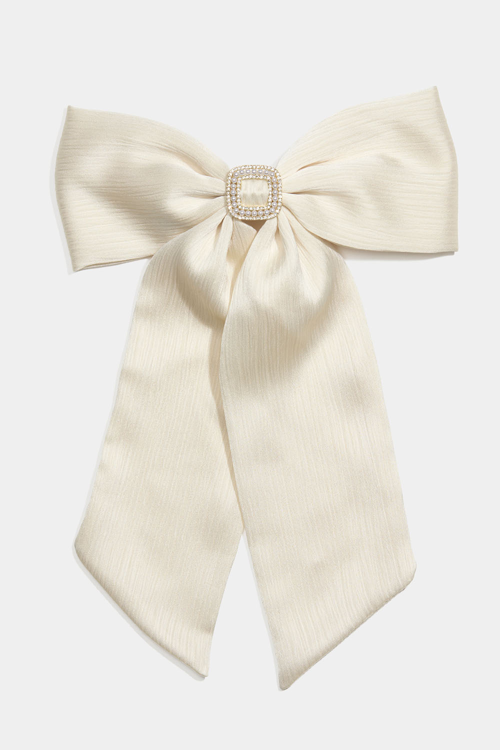 Hårspenne med hvit sløyfe og strassdetaljer